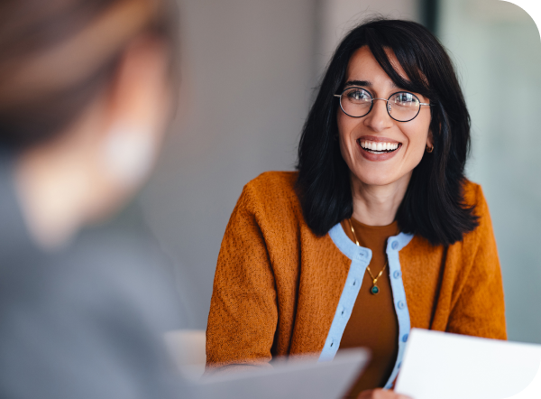 Senior living executive smiling in a meeting
